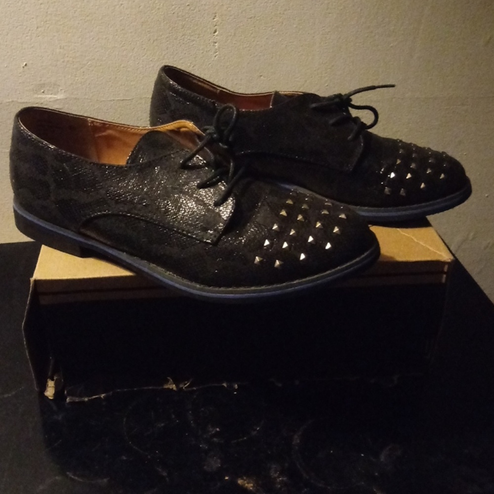 Blue lined. Black studded shoe